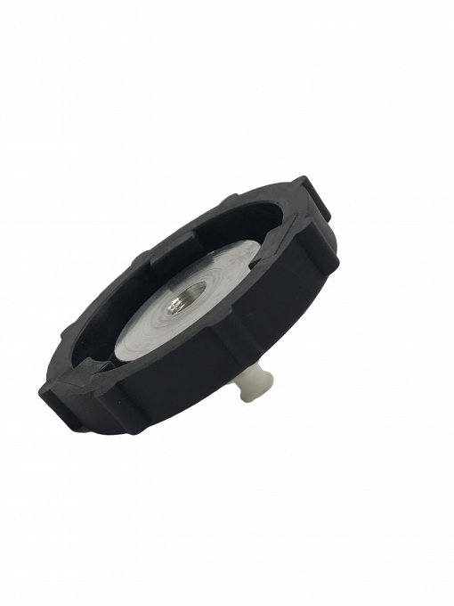 a BC-42 Master Cylinder Cap Adapter- GM 2013+ which is a black cap with a white top. It is a specialty tool used to convert a standard cap into a master cylinder cap on certain General Motors vehicles from 2013 onwards.